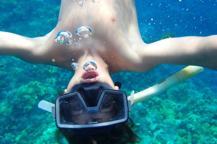 a boy swimming in the water